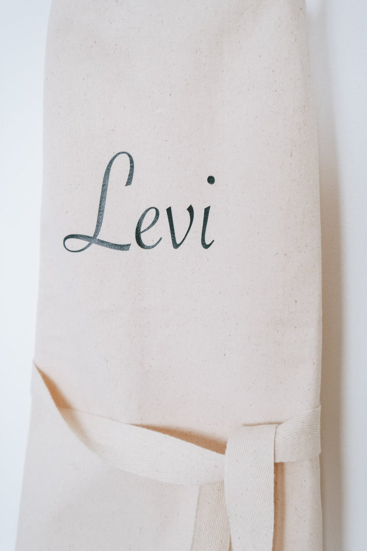 Kinderschürze personalisiert mit Namen und stilisierten Blumen - Jellies Design